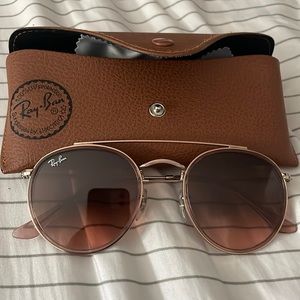 New round double bridge ray-bans that have polished copper frame and brown lens